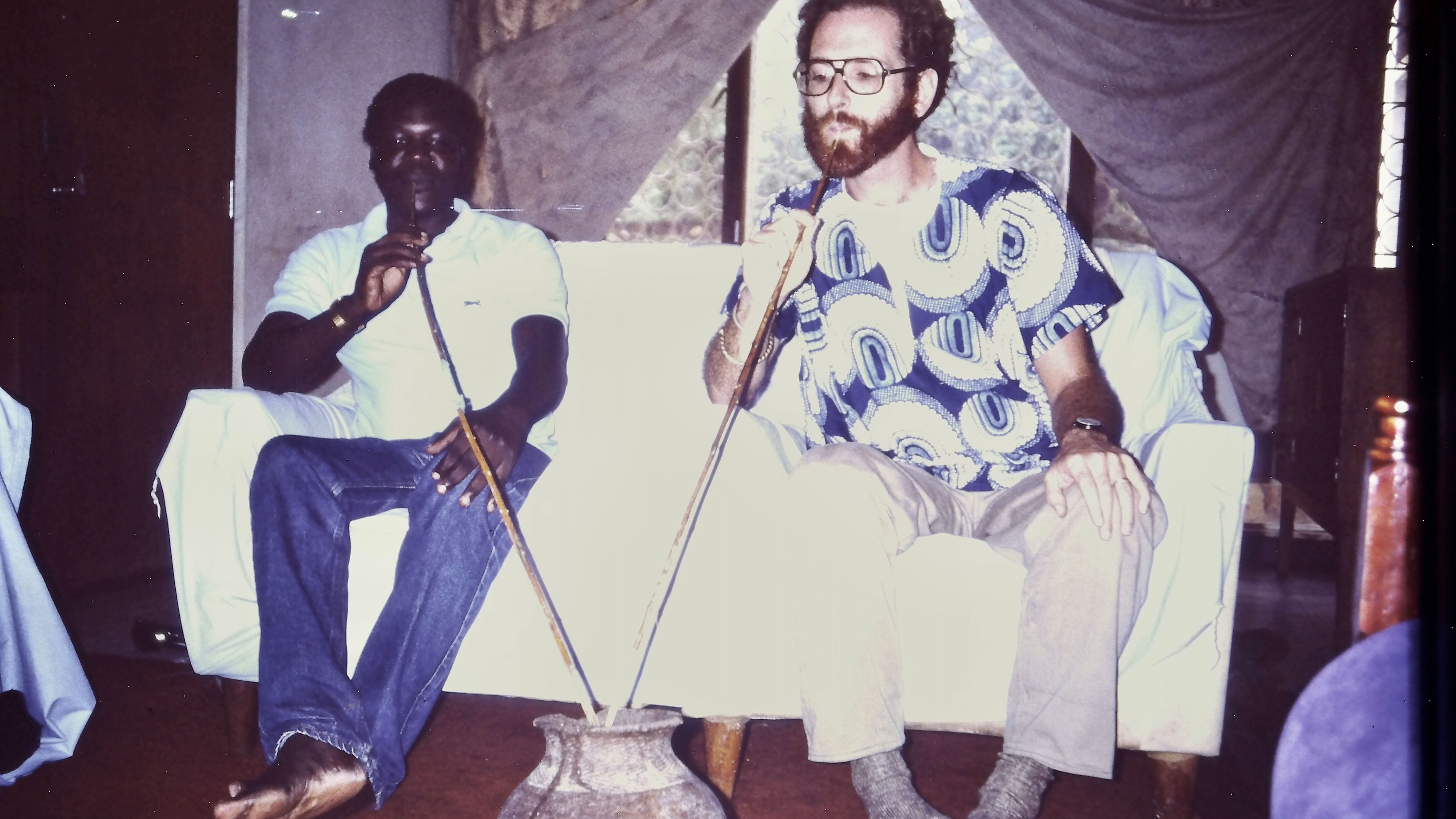 1. P. Godfrey Okoth and a fresh pot of amarwa (millet beer), Makerere University, 1988. 
