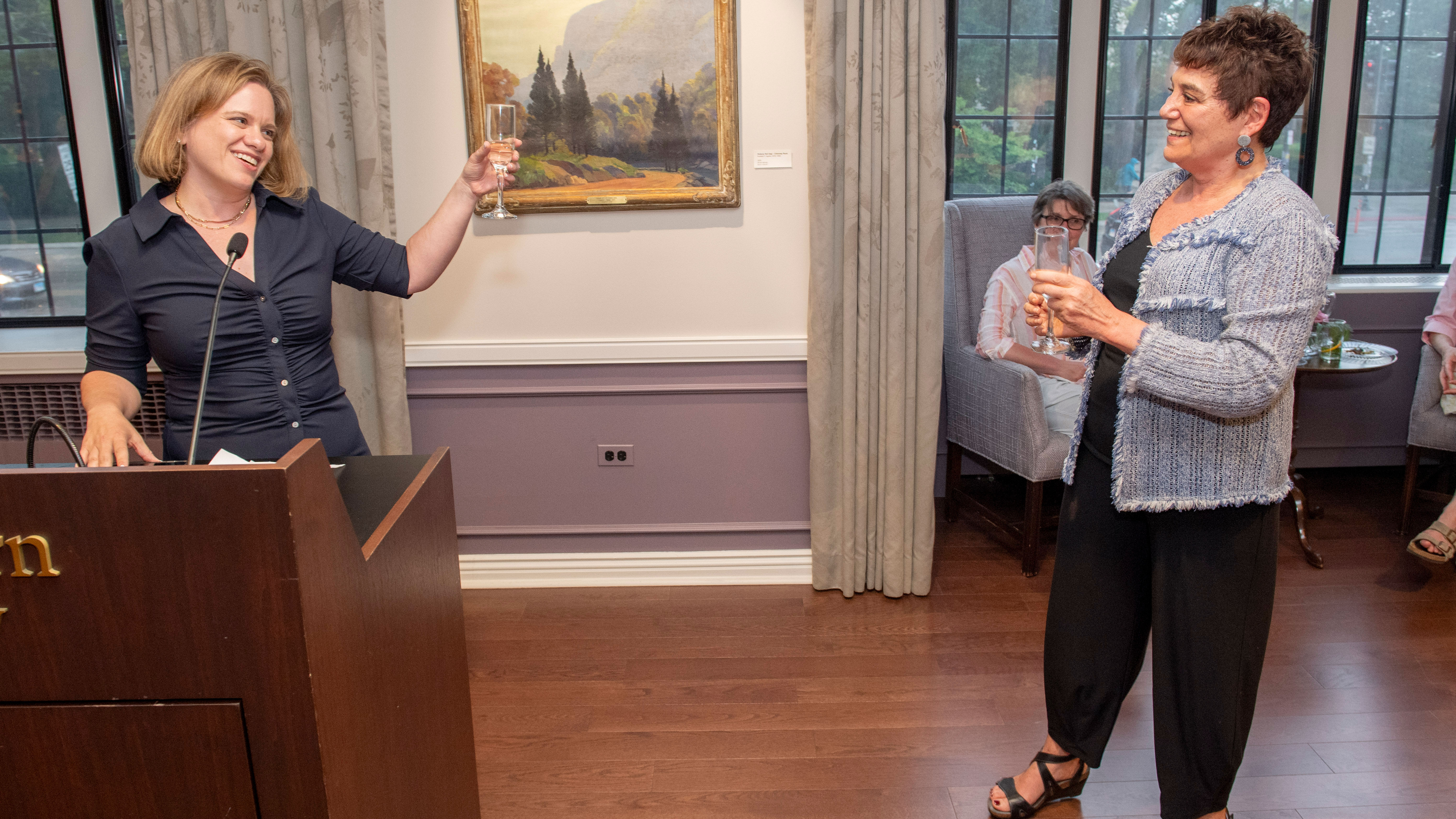 Amy Stanley toasts to Sarah Maza in Northwestern's Guild Lounge