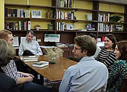 Students and professor around a seminar table