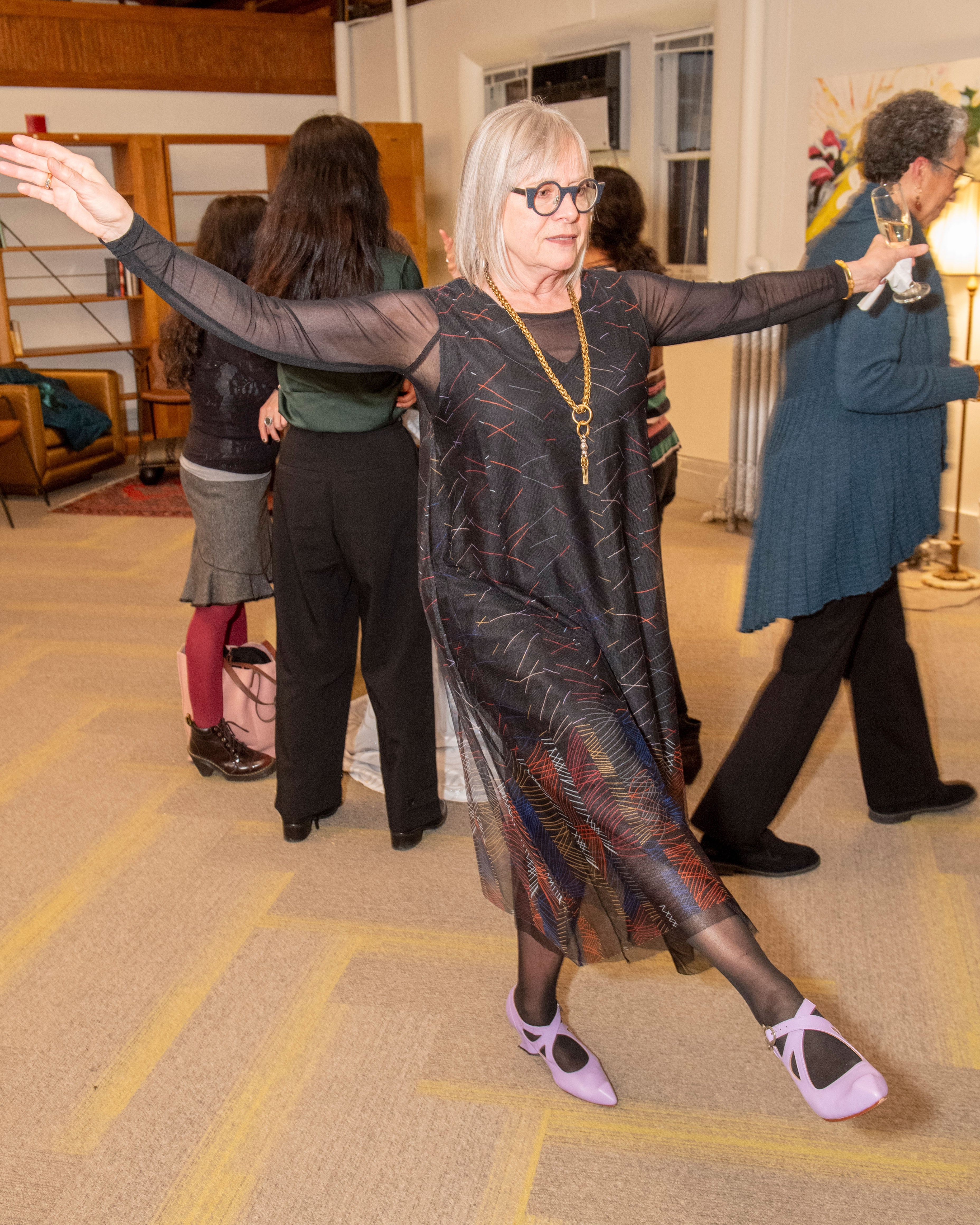 Dyan Elliot in her iconic purple dress shoes
